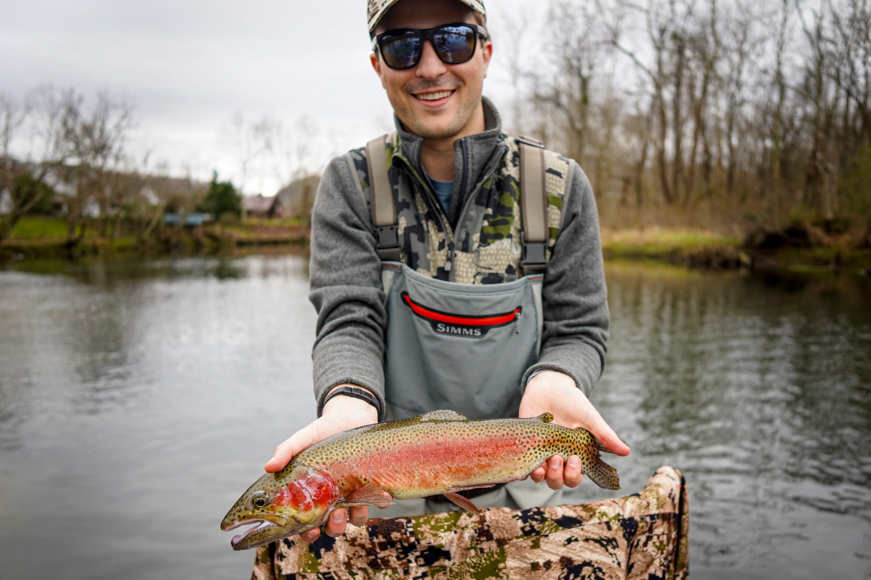 Guest Jack with a colored up rainbow trout caught on the Watauga River