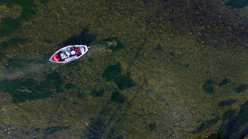 drift boat in crystal clear trout water